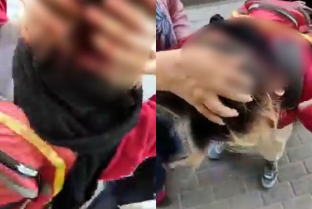 İranda əxlaq polisi etiraz edən qadının başını yardı